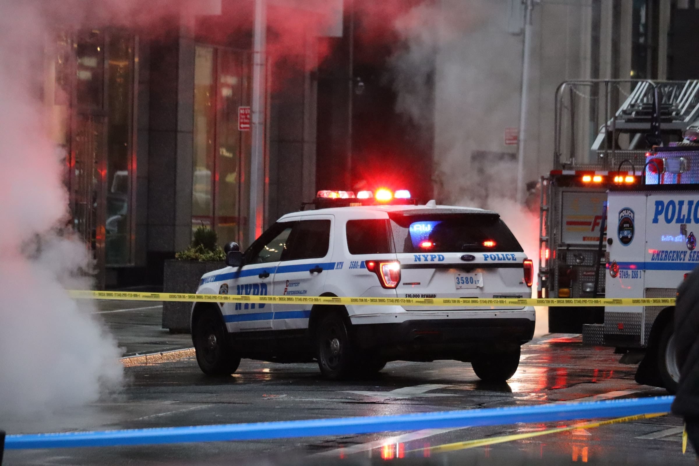 Representative photo of an NYPD vehicle behind a police "Do not cross" yellow line | Photo by Campbell Jensen on Unsplash