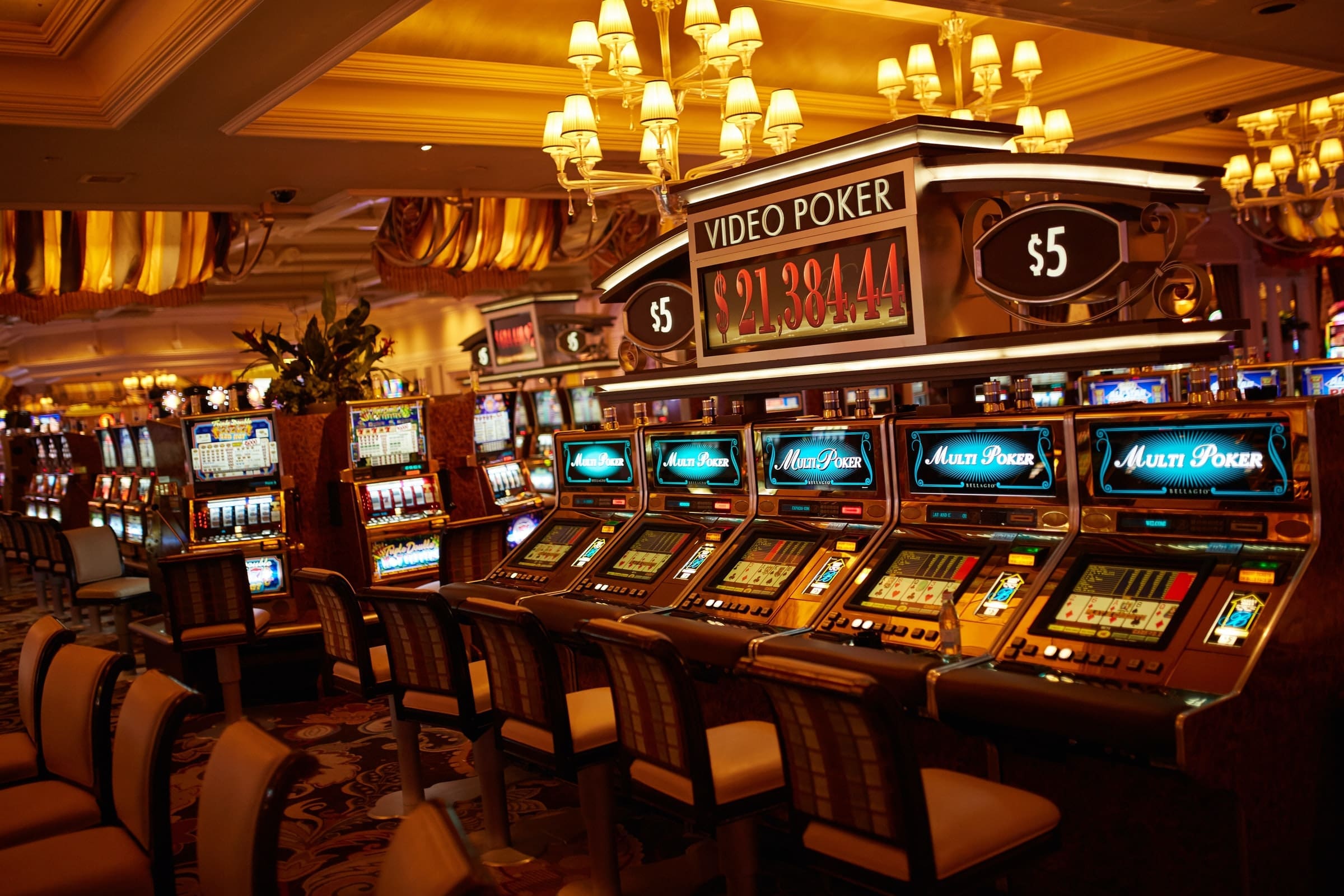 Representative photo of slot machines on a casino floor | Photo by Marco Ribbe on Unsplash