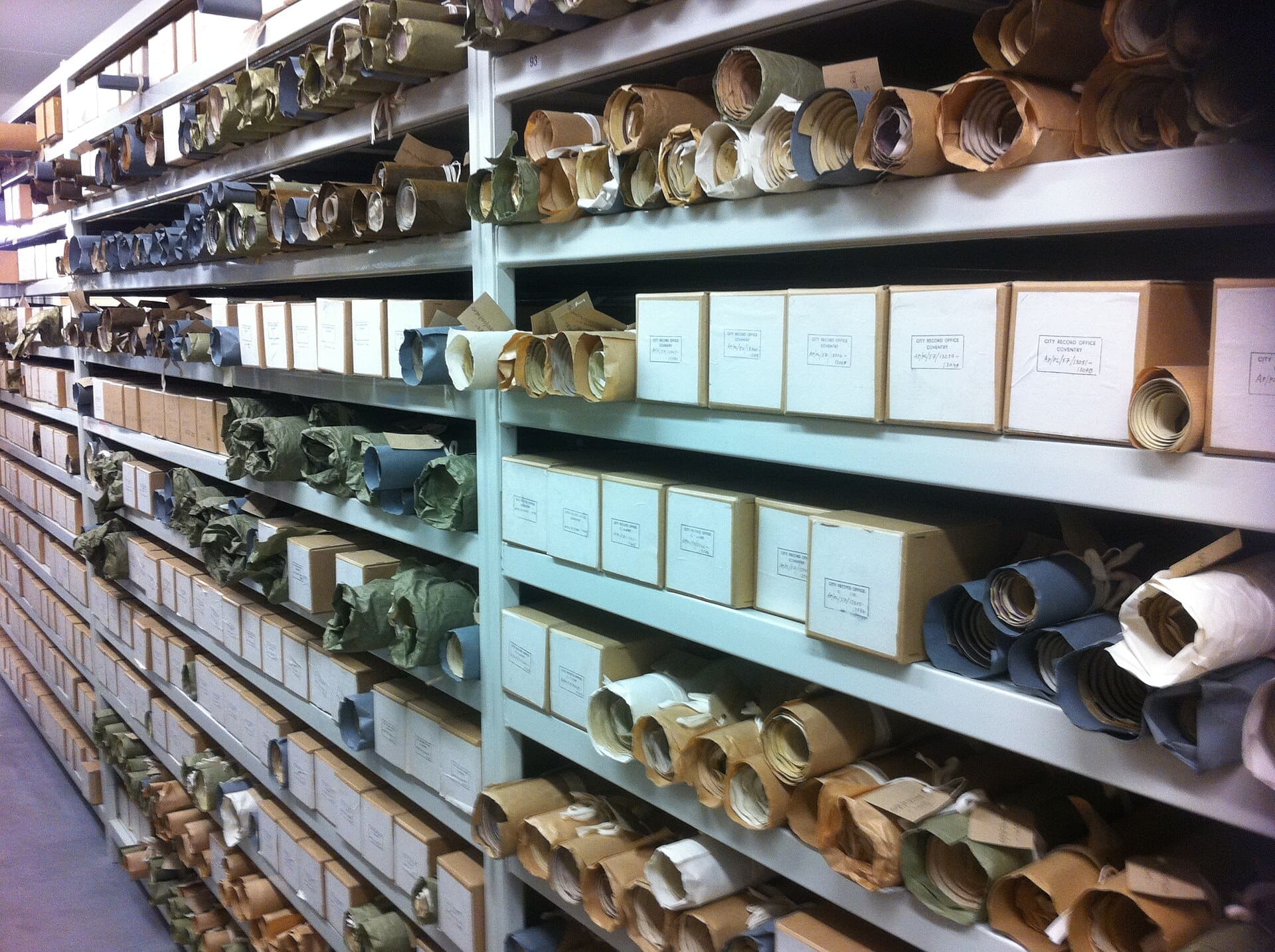 Rows of document boxes on archive shelves